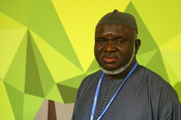 imam ibrahim saidy of norway poses at the cop21 united nations climate change conference in le bourget outside paris tuesday dec 1 2015 photo ap