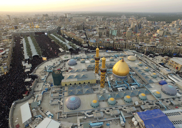 an aerial view taken on december 1 2015 shows iraqi shia pilgrims gathering at the shrines of abbas ibn ali front and imam hussein background during the arbaeen religious festival in karbala iraq photo afp
