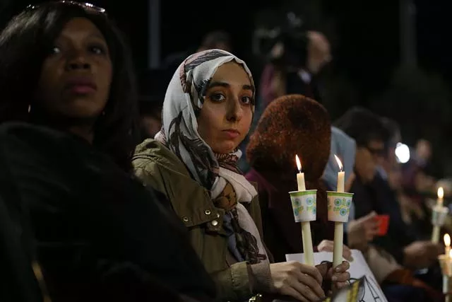 san bernardino ca december 03 people hold candles as they attend a vigil at the san manuel stadium to remember those injured and killed during the shooting at the inland regional center were killed on december 3 2015 in san bernardino california police continue to investigate a mass shooting at the inland regional center in san bernardino that left at least 14 people dead and another 17 injured on december 2nd photo afp san bernardino ca december 03 people hold candles as they attend a vigil at the san manuel stadium to remember those injured and killed during the shooting at the inland regional center were killed on december 3 2015 in san bernardino california police continue to investigate a mass shooting at the inland regional center in san bernardino that left at least 14 people dead and another 17 injured on december 2nd photo afp