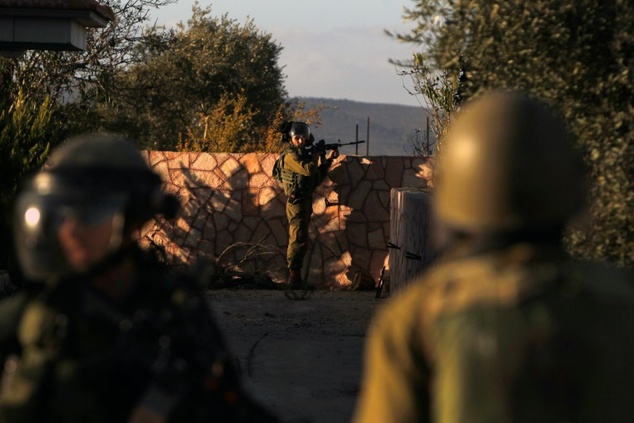 israeli security forces are pictured near the israeli settlement of ofra where a palestinian driver ran over and injured two soldiers photo afp