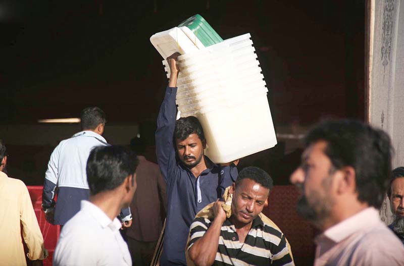 polling staff of the election commission of pakistan returns after collecting polling material for the local government elections photo online