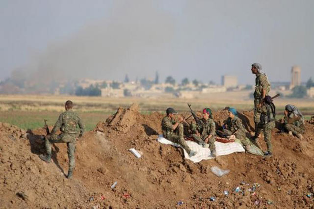 kurdish people 039 s protection units ypg fighters gather at the eastern entrance to the town of tel abyad of raqqa governorate june 15 2015 photo reuters