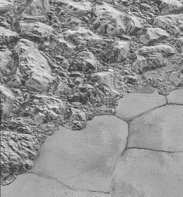 this handout picture obtained from nasa on december 5 2015 shows an image taken from nasa 039 s new horizons spacecraft showing great blocks of water ice crust jammed together in the informally named al idrisi mountains on the planet pluto photo afp