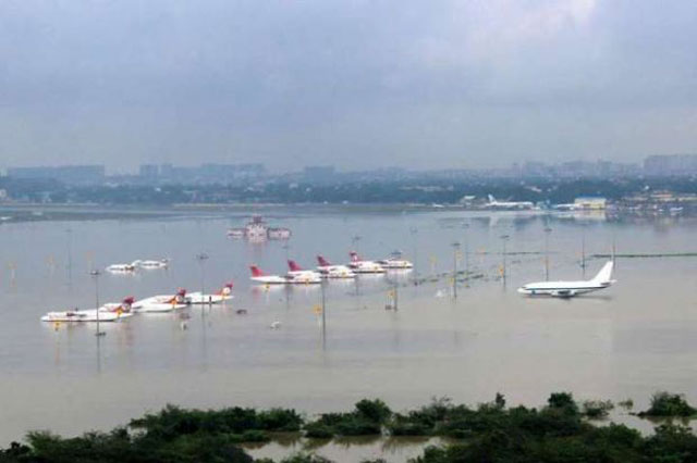 this photograph released by the press information bureau on december 2 2015 shows an aerial view of the submerged chennai airport taken from an indian air force helicopter photo afp