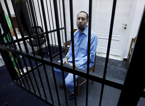 saadi kadhafi son of moamer kadhafi sits behind bars during a hearing at a courtroom in tripoli libya december 6 2015 photo reuters