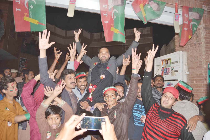 malik adnan dogar winning candidate from union council 32 multan district celebrating with his supporters have the elections photo express