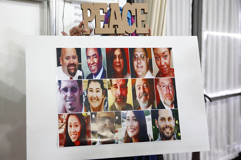 a poster showing all 14 victims is displayed during an interfaith memorial service at the islamic center of redlands for the victims of the san bernardino mass shooting photo afp