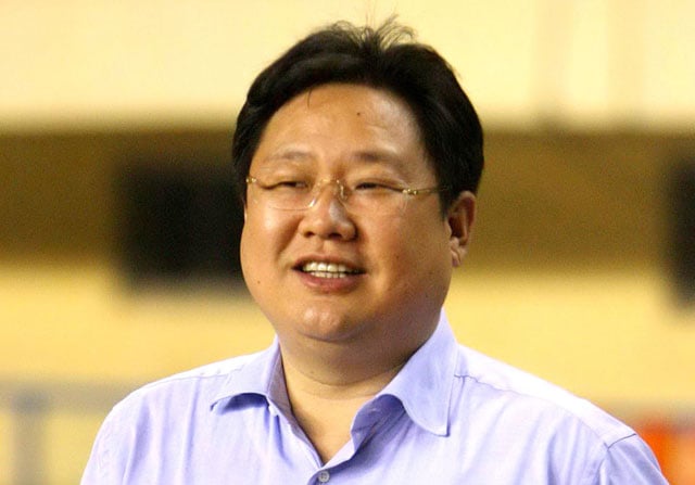 this file picture taken on september 5 2007 shows the then chairman of dalian shide group xu ming watching a chinese super league game between dalian shide fc and bejing guoan fc in dalian in northeast china 039 s liaoning province photo afp