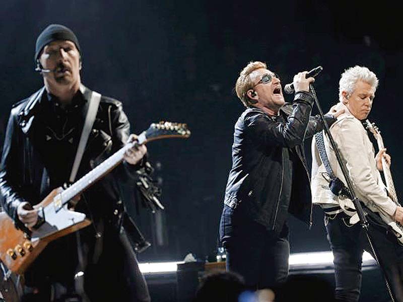 bono c the edge l and adam clayton of irish band u2 perform during their concert at the accorhotels arena in paris photo reuters