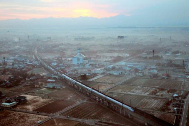 the first train of the new hokuriku shinkansen or bullet train bound for tokyo runs near shin takaoka station in takaoka toyama prefecture march 14 2015 in this aerial view photo taken by kyodo photo reuters the first train of the new hokuriku shinkansen or bullet train bound for tokyo runs near shin takaoka station in takaoka toyama prefecture march 14 2015 in this aerial view photo taken by kyodo photo reuters