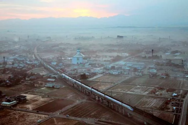 the first train of the new hokuriku shinkansen or bullet train bound for tokyo runs near shin takaoka station in takaoka toyama prefecture march 14 2015 in this aerial view photo taken by kyodo photo reuters the first train of the new hokuriku shinkansen or bullet train bound for tokyo runs near shin takaoka station in takaoka toyama prefecture march 14 2015 in this aerial view photo taken by kyodo photo reuters