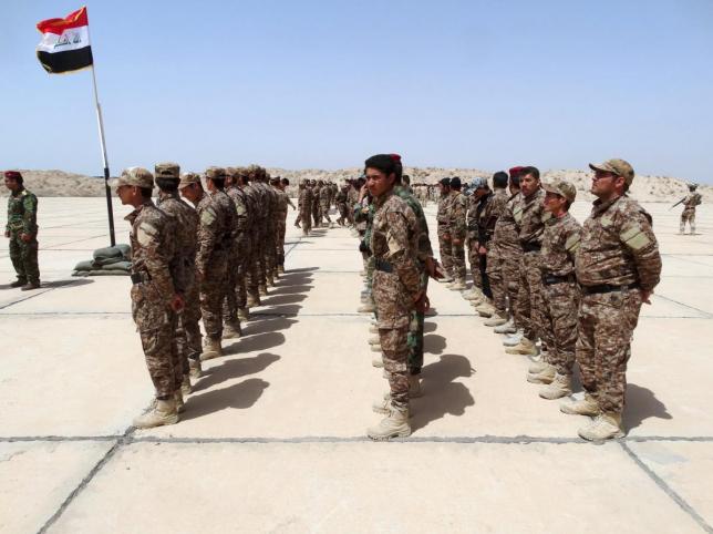 sunni tribesmen attend a ceremony to present them with weapons at camp habbaniyah in the eastern city of ramadi april 8 2015 photo reuters