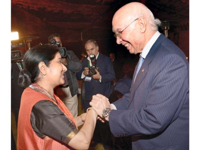 sartaj aziz welcomes sushma swaraj in islamabad photo afp sartaj aziz welcomes sushma swaraj in islamabad photo afp