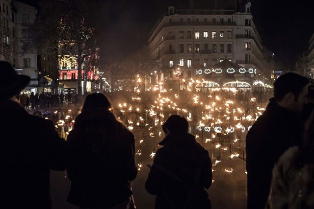 members of the public gather for the lighting of a candle display on december 8 2015 in lyon in tribute to victims of the november 13 paris terrorist attacks and as a replacement for the cancelled annual festival of lights a secular version of a religious tradition devoted to the virgin mary and dating back to 153 years ago photo afp