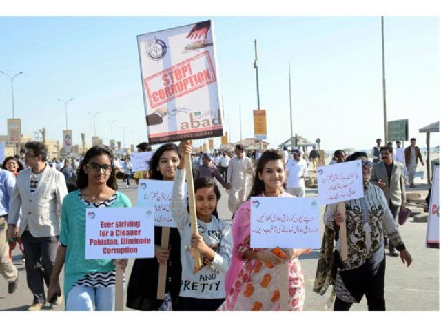 participants at an awareness walk at sea view clifton organised by the national accountability bureau nab sindh photo express