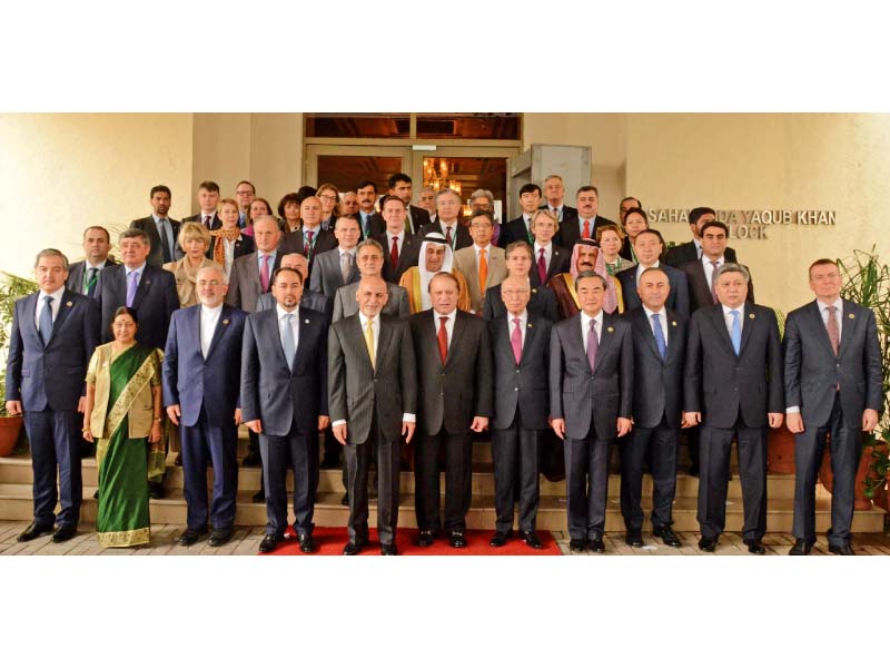 delegates pose for a photograph on first day of the heart of asia conference in islamabad photo afp