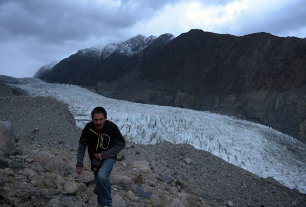 in this photograph taken on september 28 2015 a pakistan meteorological department pmd employee takes observations at a glacier monitoring station set at an elevation of 4 500 meters at the 26km long passu glacier in the gojal valley photo afp