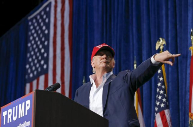 us republican presidential candidate donald trump motions for security to remove a person from his rally in sarasota florida november 28 2015 photo reuters us republican presidential candidate donald trump motions for security to remove a person from his rally in sarasota florida november 28 2015 photo reuters