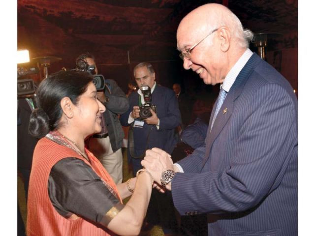 sartaj aziz welcomes sushma swaraj in islamabad photo afp sartaj aziz welcomes sushma swaraj in islamabad photo afp