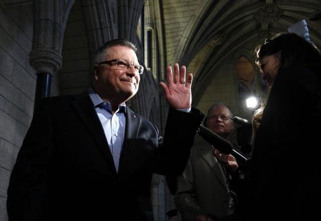 liberal mp ralph goodale speaks to journalists as he arrives for a caucus meeting on parliament photo reuters