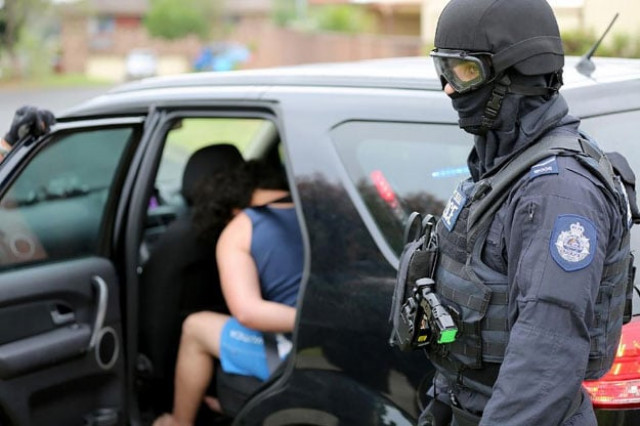 a man is being arrested during a counter terrorism operation in sydney on december 10 2015 photo afp a man is being arrested during a counter terrorism operation in sydney on december 10 2015 photo afp