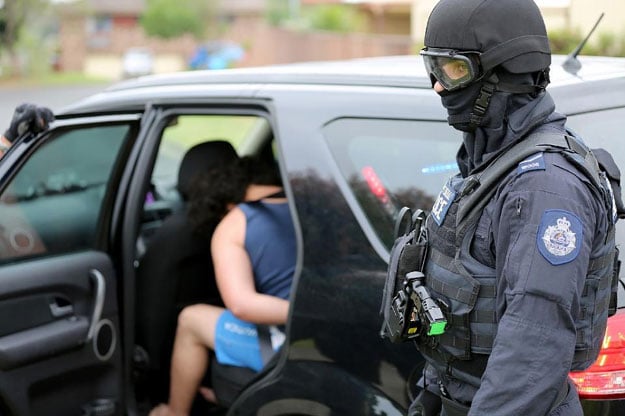 a man is being arrested during a counter terrorism operation in sydney on december 10 2015 photo afp