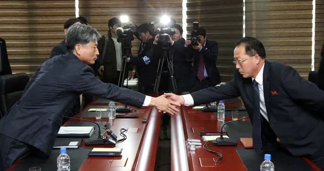 south korean vice unification minister hwang boo gi l seoul 039 s chief delegate for high level talks with north korea shakes hands with his north korean counterpart jon jong su r during their meeting at the kaesong joint industrial zone on the north korean side of the border on december 11 2015 photo afp south korean vice unification minister hwang boo gi l seoul 039 s chief delegate for high level talks with north korea shakes hands with his north korean counterpart jon jong su r during their meeting at the kaesong joint industrial zone on the north korean side of the border on december 11 2015 photo afp