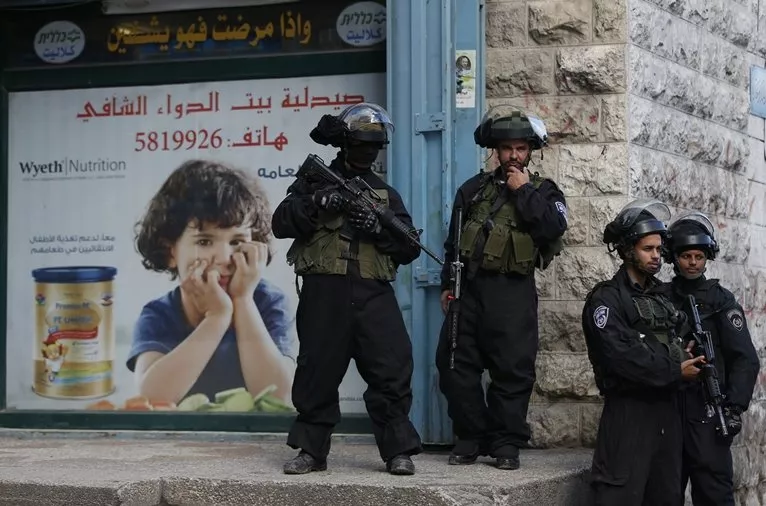 israeli security forces stand guard in the east jerusalem shuafat refugee camp ahead of a planned demolition of a home of a palestinian who carried out car ramming attack last year on december 2 2015 photo afp israeli security forces stand guard in the east jerusalem shuafat refugee camp ahead of a planned demolition of a home of a palestinian who carried out car ramming attack last year on december 2 2015 photo afp