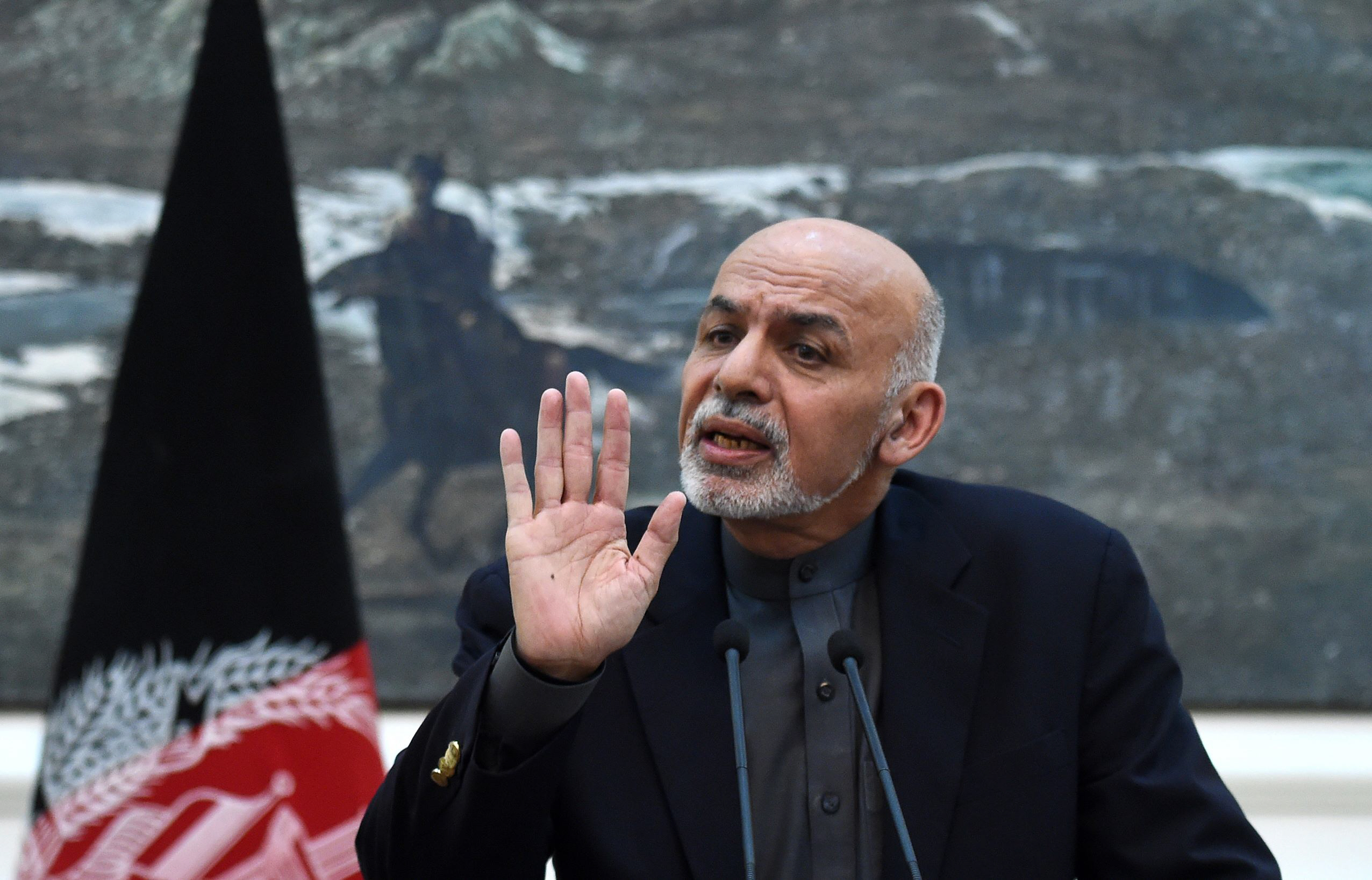 afghan president ashraf ghani gestures as he addresses a press conference at the presidential palace in kabul on december 11 2015 photo afp