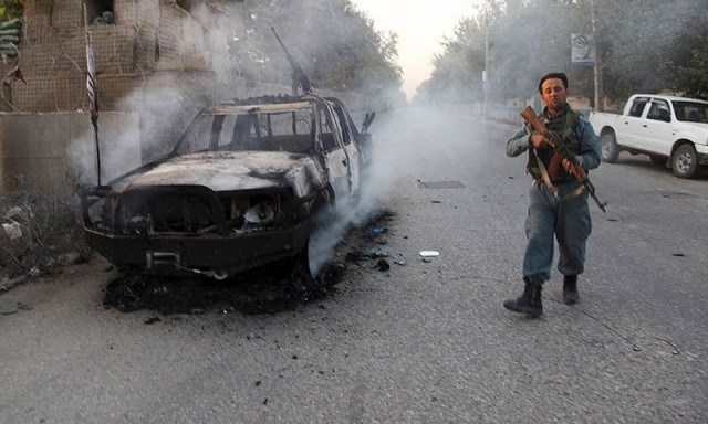 a file photo of an afghan policeman patrolling next to a burning vehicle in the city of kunduz afghanistan photo reuters a file photo of an afghan policeman patrolling next to a burning vehicle in the city of kunduz afghanistan photo reuters