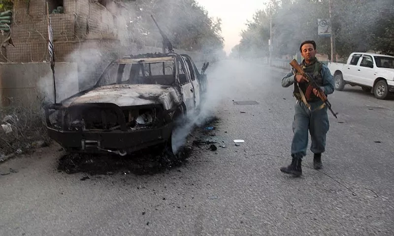 a file photo of an afghan policeman patrolling next to a burning vehicle in the city of kunduz afghanistan photo reuters a file photo of an afghan policeman patrolling next to a burning vehicle in the city of kunduz afghanistan photo reuters