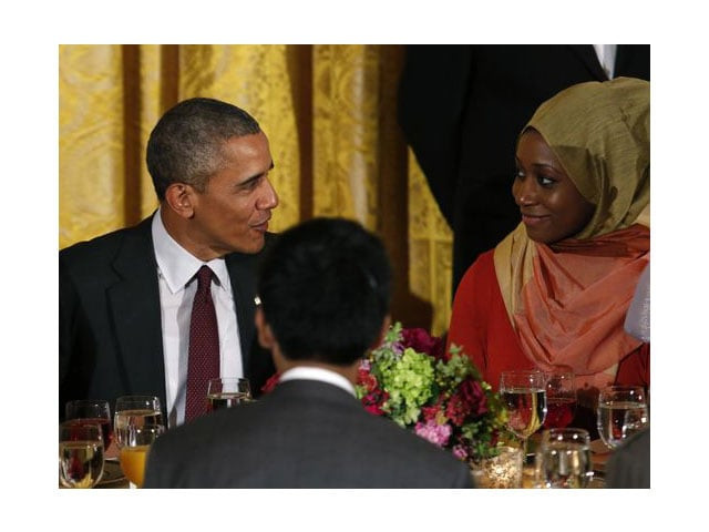 president obama talks to a guest during an iftar dinner celebrating ramadan in the state dining room at the white house on june 22 photo afp