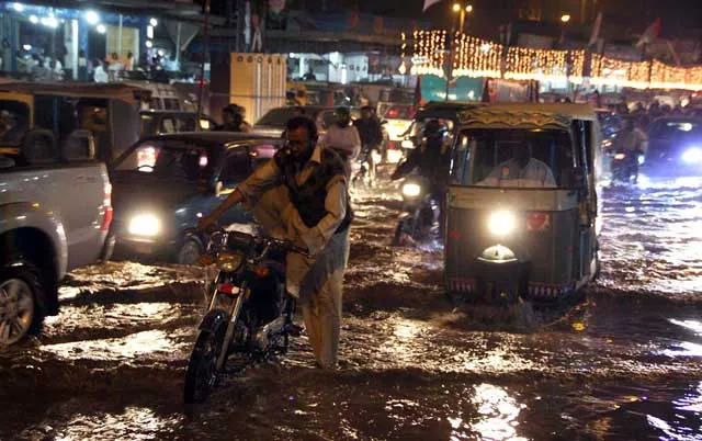 a road near gulshan e iqbal is submerged in water after a pipeline burst in the area on december 12 2015 photo online a road near gulshan e iqbal is submerged in water after a pipeline burst in the area on december 12 2015 photo online