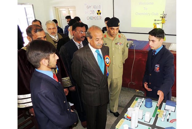 governor sardar mehtab ahmed khan visiting a stall during science exhibition held at abbottabad public school photo online