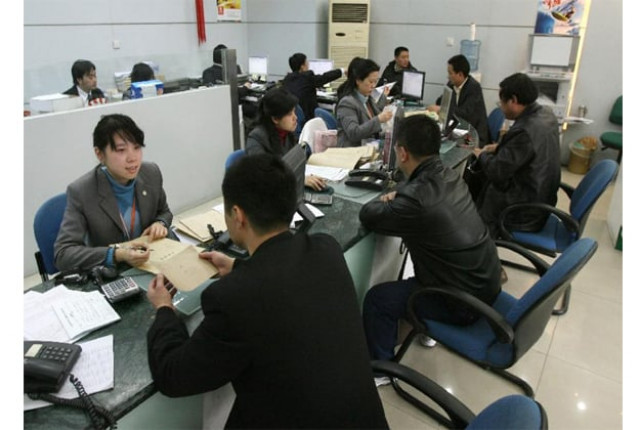chinese customers at the offices of the ping an insurance company in shanghai photo afp chinese customers at the offices of the ping an insurance company in shanghai photo afp