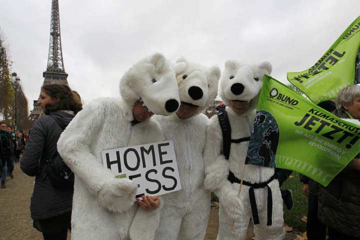 three environmentalists wear polar bear costumes as they take part in a demonstration near the eiffel tower in paris france as the world climate change conference 2015 cop21 continues near the french capital in le bourget december 12 2015 photo reuters