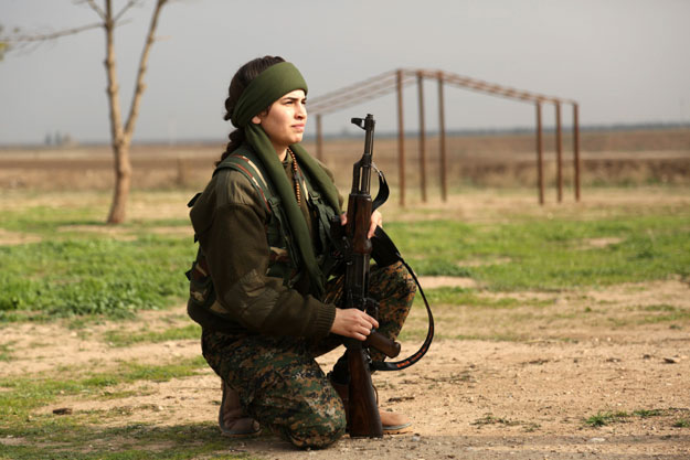 syriac christian lucia member of the battalion called the quot female protection forces of the land between the two rivers quot fighting the islamic state group poses during a training on december 1 2015 at their camp in the town of al qahtaniyah near the syrian turkish border aka kabre hyore in syriac and tirbespi in kurdish photo afp