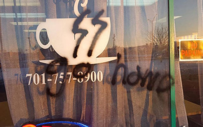 muslim owned cafe in us defaced with nazi graffiti set ablaze