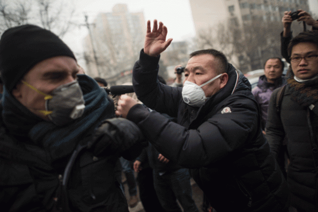 chinese police push away journalists and supporters of human rights lawyer pu zhiqiang demonstrating near the beijing second intermediate people 039 s court in beijing on december 14 2015 photo afp chinese police push away journalists and supporters of human rights lawyer pu zhiqiang demonstrating near the beijing second intermediate people 039 s court in beijing on december 14 2015 photo afp