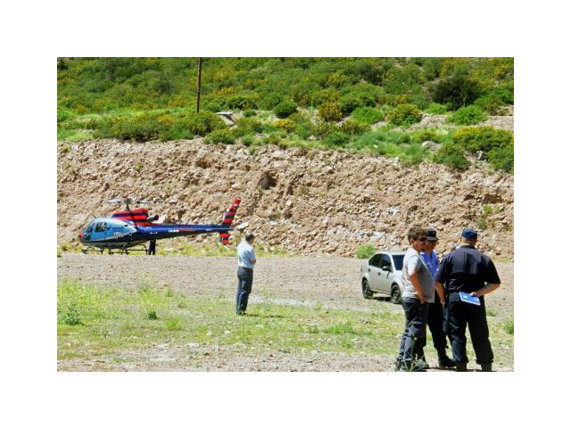 a police helicopter at the scene of a helicopter crash in potrerillos argentina on december 12 2015 photo afp