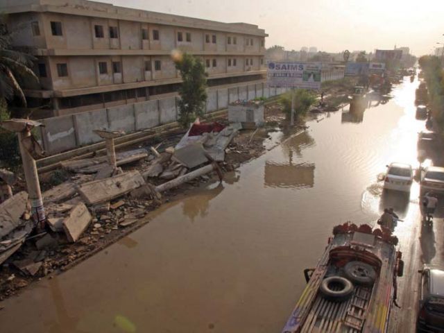 university road was inundated on saturday evening when a water supply line measuring 84 inches in diameter burst near the federal urdu university of arts science and technology photo athar khan express