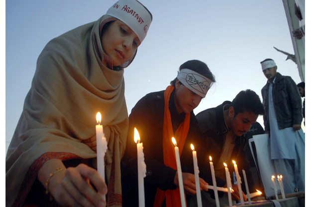 members of civil society are enlightening candles in commemoration of martyrs of aps photo ppi