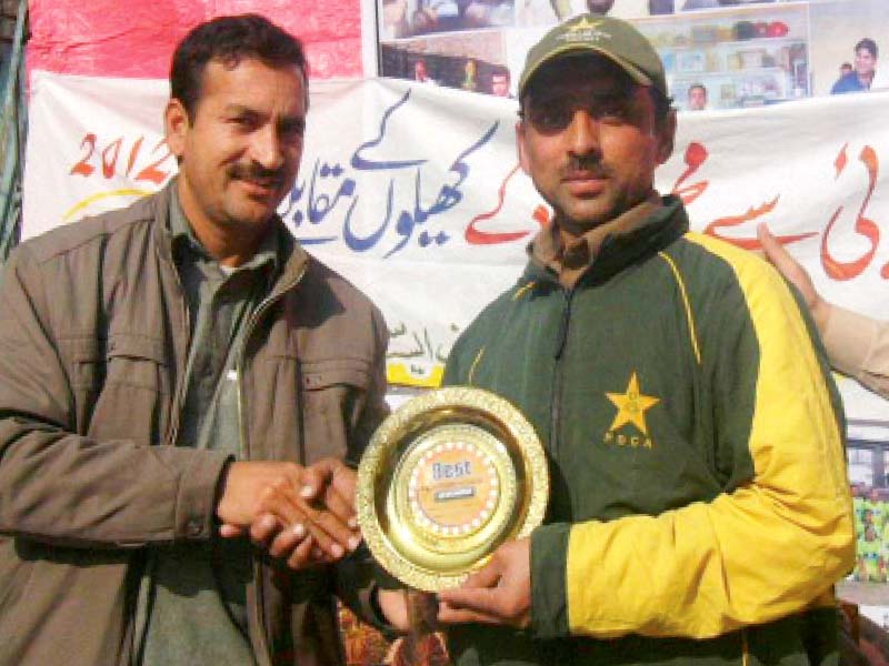 cricketer muhammad fayaz receives an award photos courtesy muhammad fayaz s family