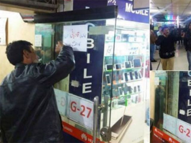 abid hashmi is accused of installing the poster at his hafeez centre shop photo twitter abid hashmi is accused of installing the poster at his hafeez centre shop photo twitter