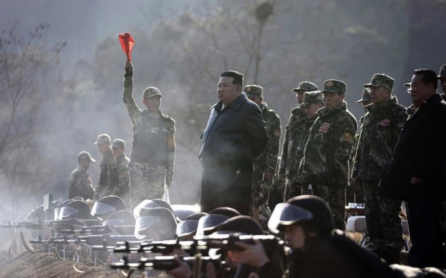 north korean leader kim jong un watches troops fire their rifles at an undisclosed military base march 6 2024 photo korean central news agency