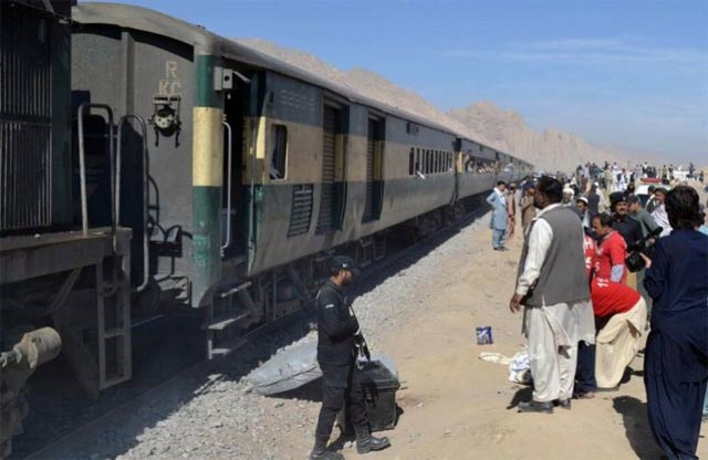 pakistani security officials stand next to a passenger train compartment on november 1 2015 photo afp