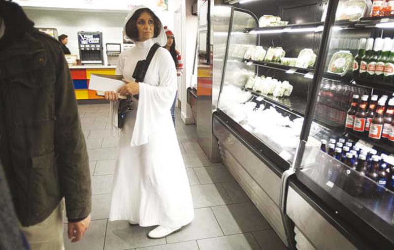 a woman dressed as princess leia waits in line to buy food at comiccon in new york in 2013 file photo photo reuters