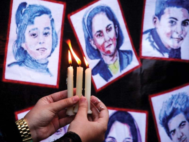 schoolchildren pay tribute to aps victims in a candlelight vigil in karachi photo athar khan express schoolchildren pay tribute to aps victims in a candlelight vigil in karachi photo athar khan express