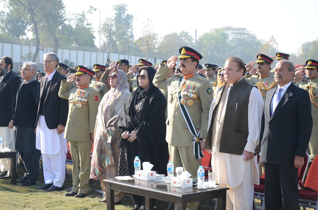 prime minister coas governor and chief minister along with other parliamentarians and senior civil and military officials paying honours while the national anthem is being played at a ceremony held at peshawar aps today to pay homage to the victims of 16 december 2014 attack photo ispr