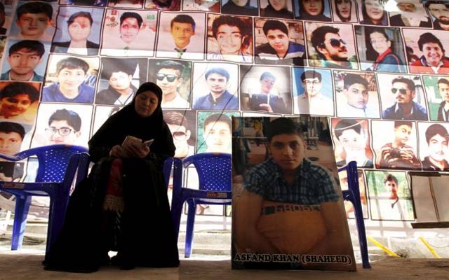 shahana ajoon mother of asfand khan sits beside a picture of her son in peshawar pakistan december 11 2015 photo reuters